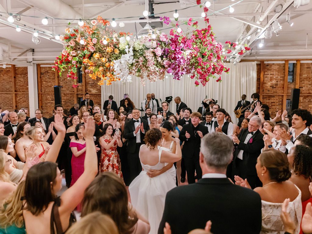 Brides dancing in the middle of a packed dance floor at their reception.  Baltimore, Northern Virginia, Annapolis, Eastern Shore, DC wedding planners