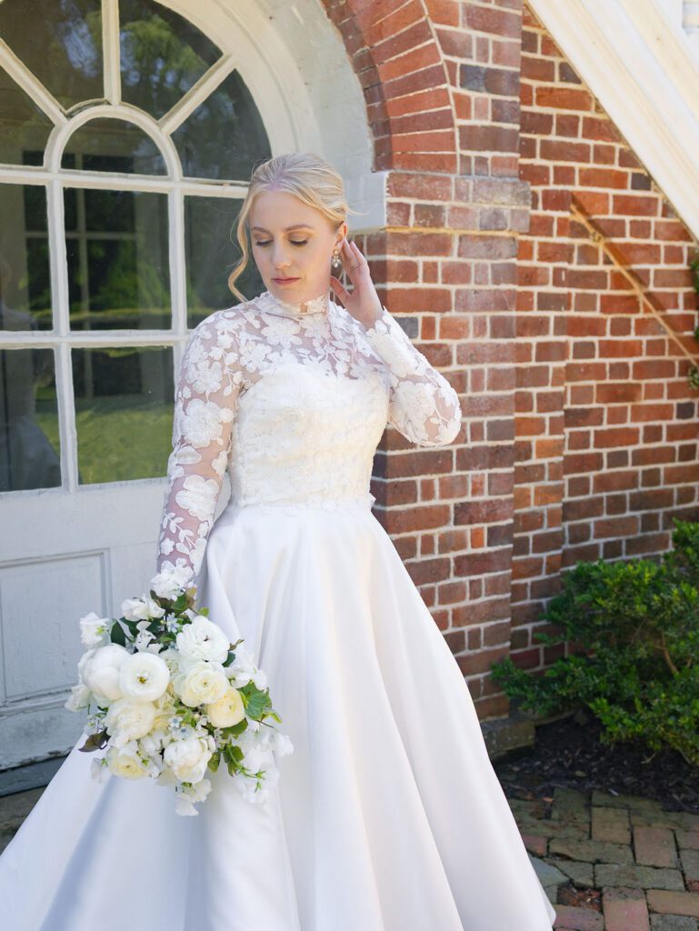bride wearing a classic white wedding gown with a lace overlay